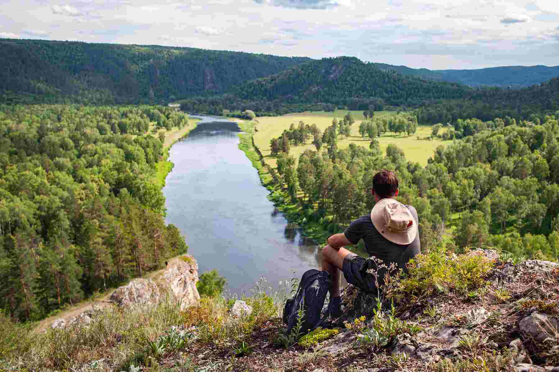 tourist-with-backpack-camera-rock-enjoying-view-river-valley (1).jpg